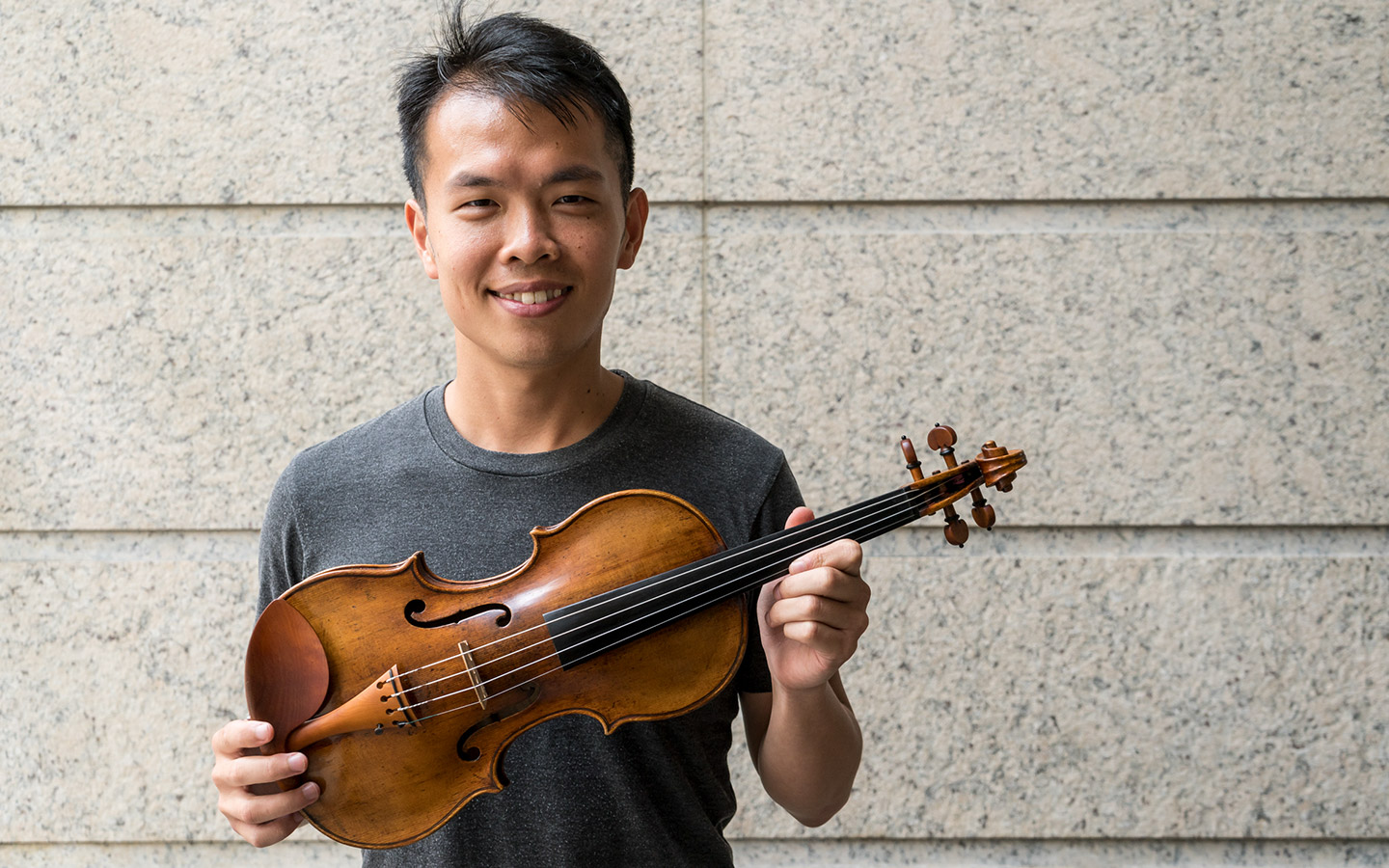 Ike See with a newly acquired violin