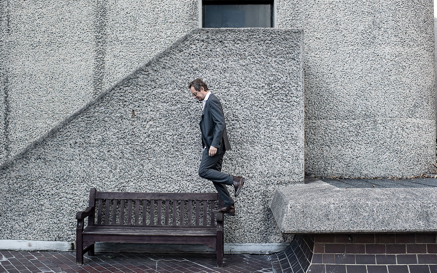 Richard Tognetti jumping onto a chair at the Barbican Centre
