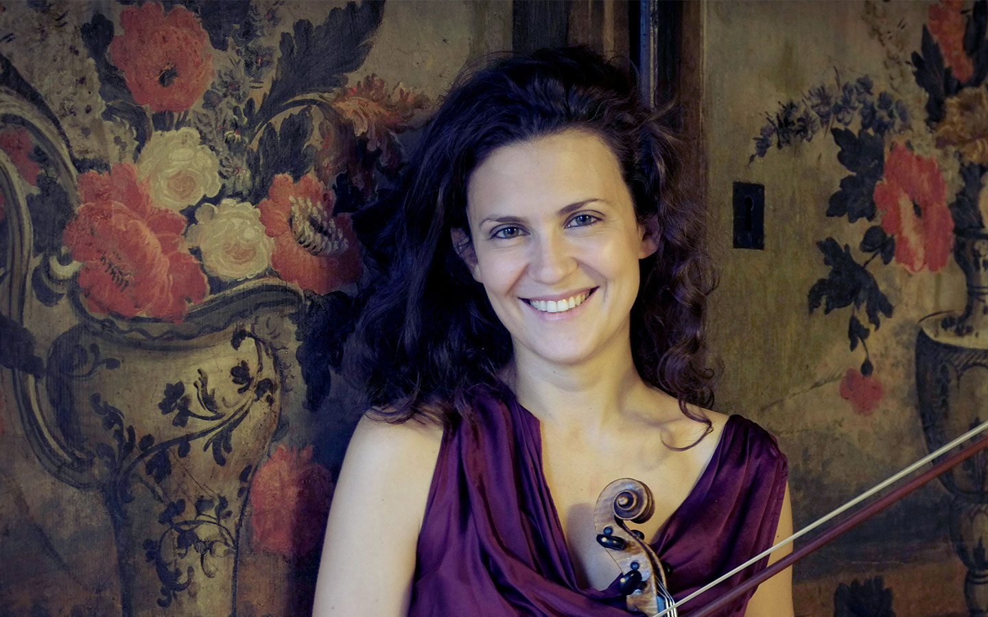 Italian violinist Lorenza Borrani posing for a portrait with her instrument