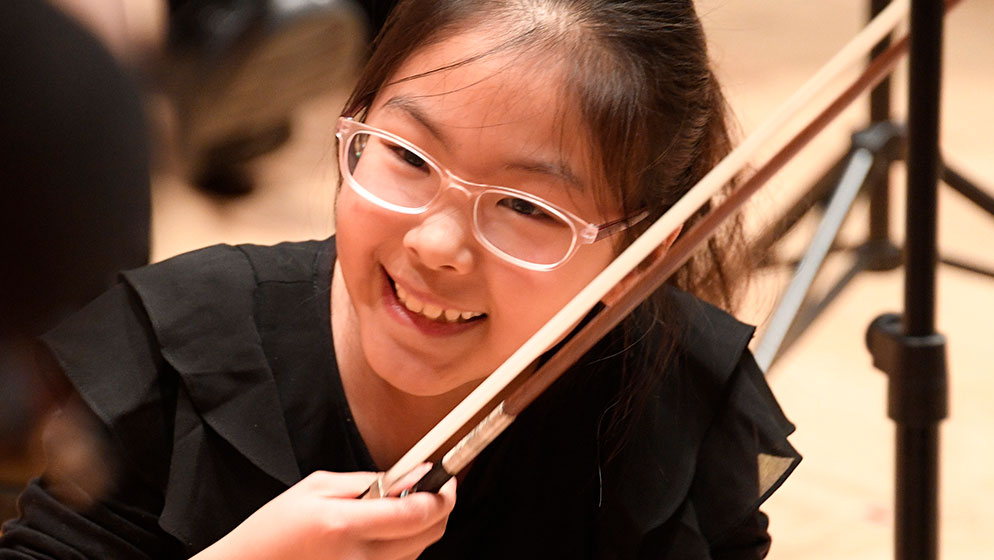 A member of ACO Academy smiling