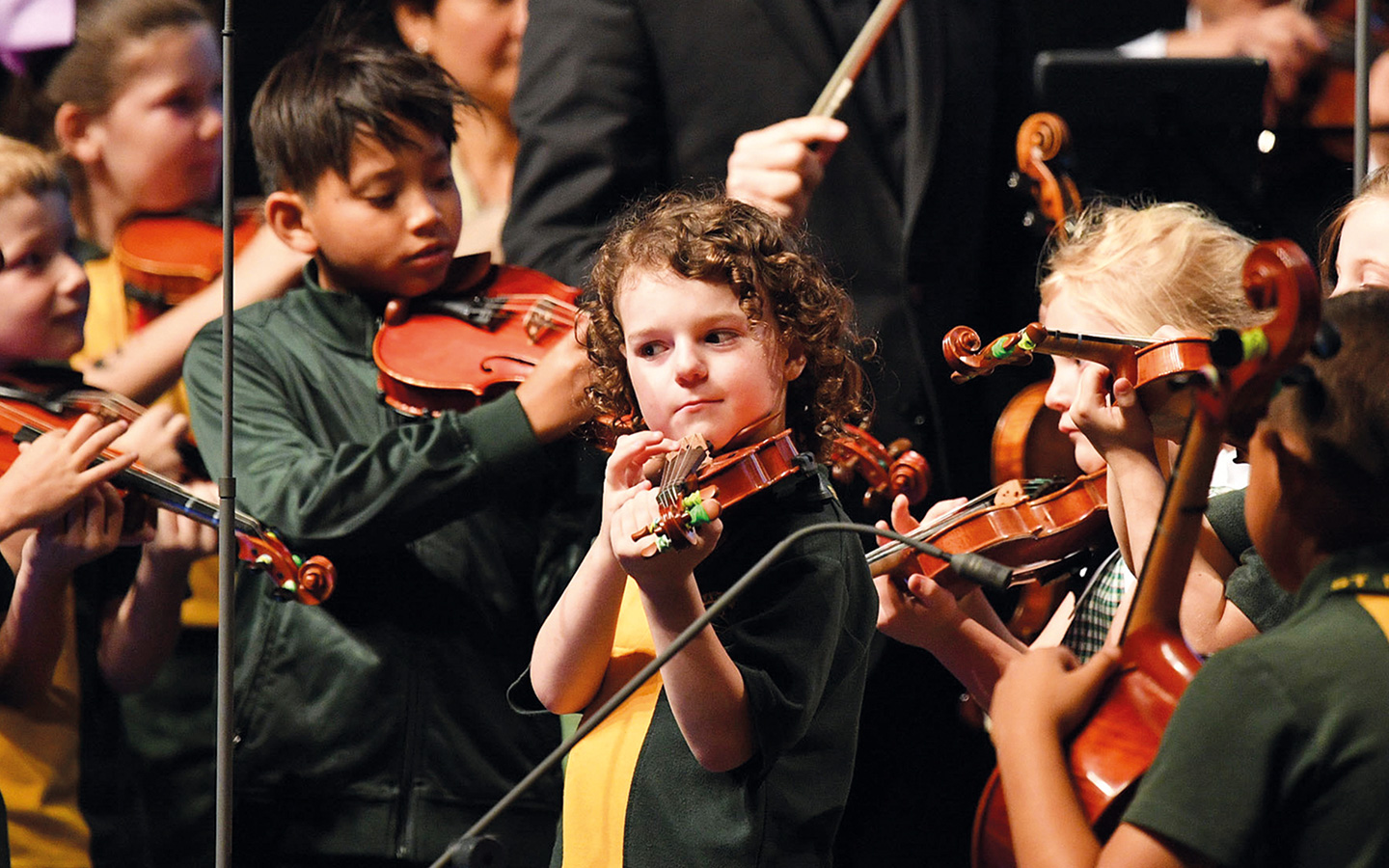 Child from St Marys school learning to play the violin. 