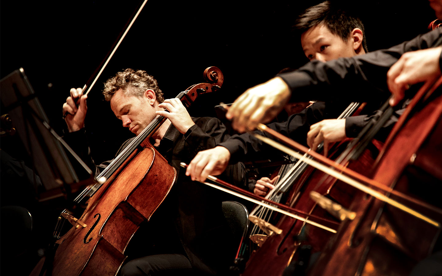 ACO Cellist Julian Thompson performing onstage